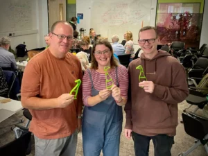 Andy, Katie and Alex holding plastic duck biscuit cutters